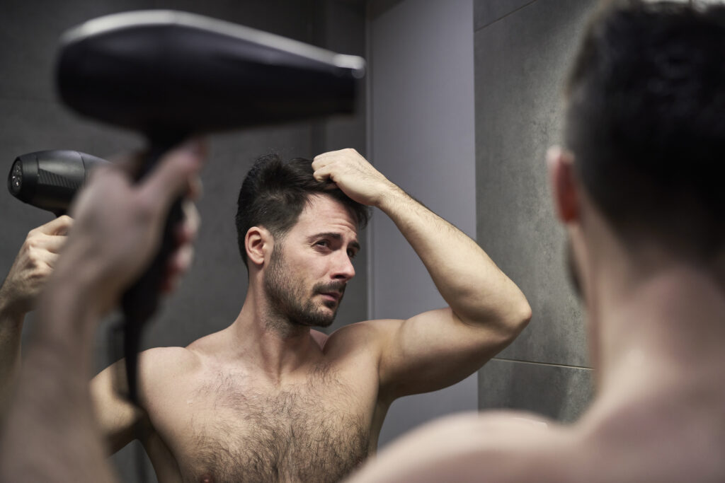 efeito colateral do minoxidil